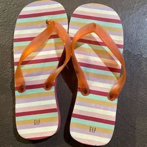 Red stripped flip flops